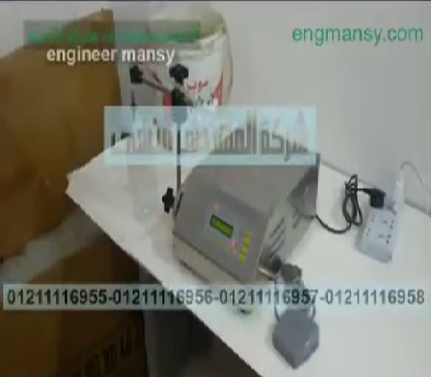 ماكينة إستانلس ديجيتال لتعبئة عبوات زيت جوز هند كود 451 ماركة مهندس منسي
