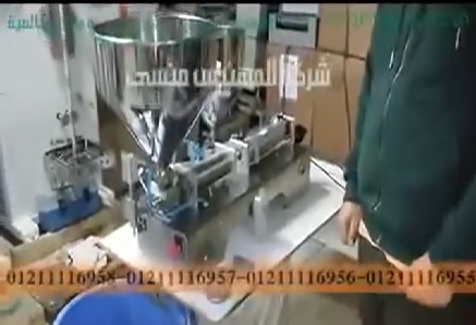 ماكينة تعبئة زيت حليب الهند في عبوات 500 مل موديل 404 ماركة مهندس منسي