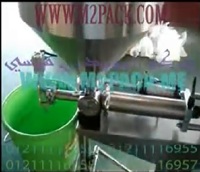 ماكينة تعبئة سوائل لزجة فى عبوات تعمل بدواسة القدم بقوة الهواء المضغوط موديل404 ماركة الهندس منسى