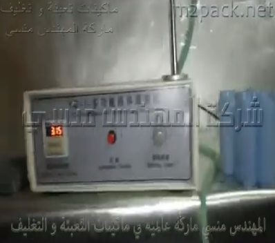 ماكينة تعبئة سوائل نصف أتوماتيكية لعبوات غرغرة الفم ديسك توب موديل 451 ماركة مهندس منسي