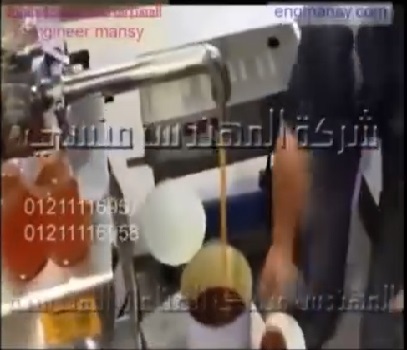 ماكينة نصف أوتوماتيك لتعبئة العسل بجميع أنواعه بعبوات زجاج كود 404 ماركة مهندس منسي