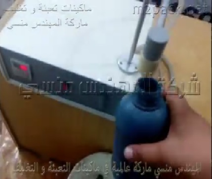 ماكينة هاف أتوماتيك لتعبئة سوائل خفيفة مثل التنر بعبوات 1 لتر ، كود 451 ، ماركة مهندس منسي
