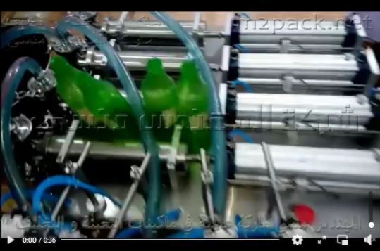 ماكينة بدواسه نصف اتوماتيك لتعبئة سوائل مثل حليب و زيت و شامبو و جل و عصير ذات 4 نوزل كود 403 IIII