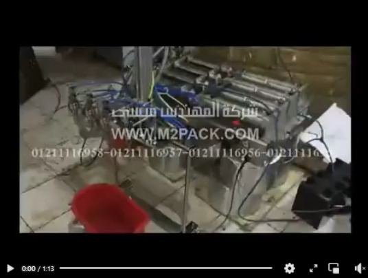 ماكينة تعبئة سوائل 4نزل نص اوتوماتيك موديل403 ماركة المهندس منسى لتعبئة العصائر والزيوت فى زجاجات ماركة المهندس منسى